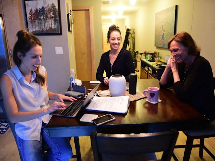 Back home Grunewald has the support of her mother, Laura (right), and sister Abby (middle).